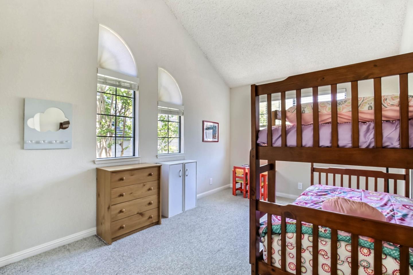 104 Redding Road Campbell, CA 95008 - Photo 12 of 23 a bedroom with furniture a baby crib and a window