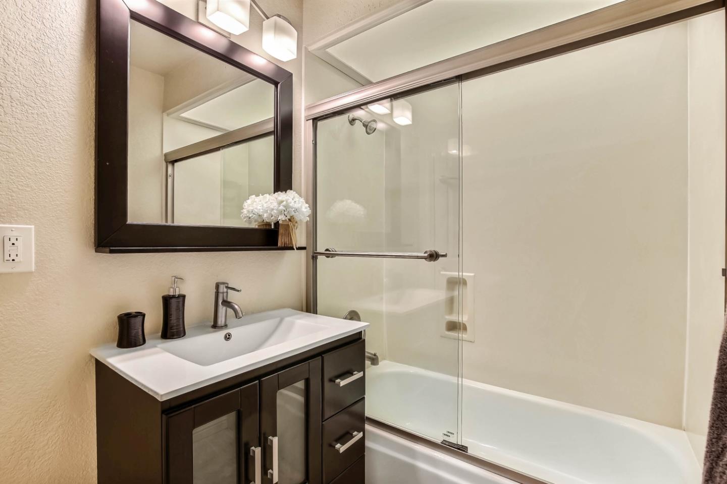 104 Redding Road Campbell, CA 95008 - Photo 17 of 23 a bathroom with a sink and a mirror