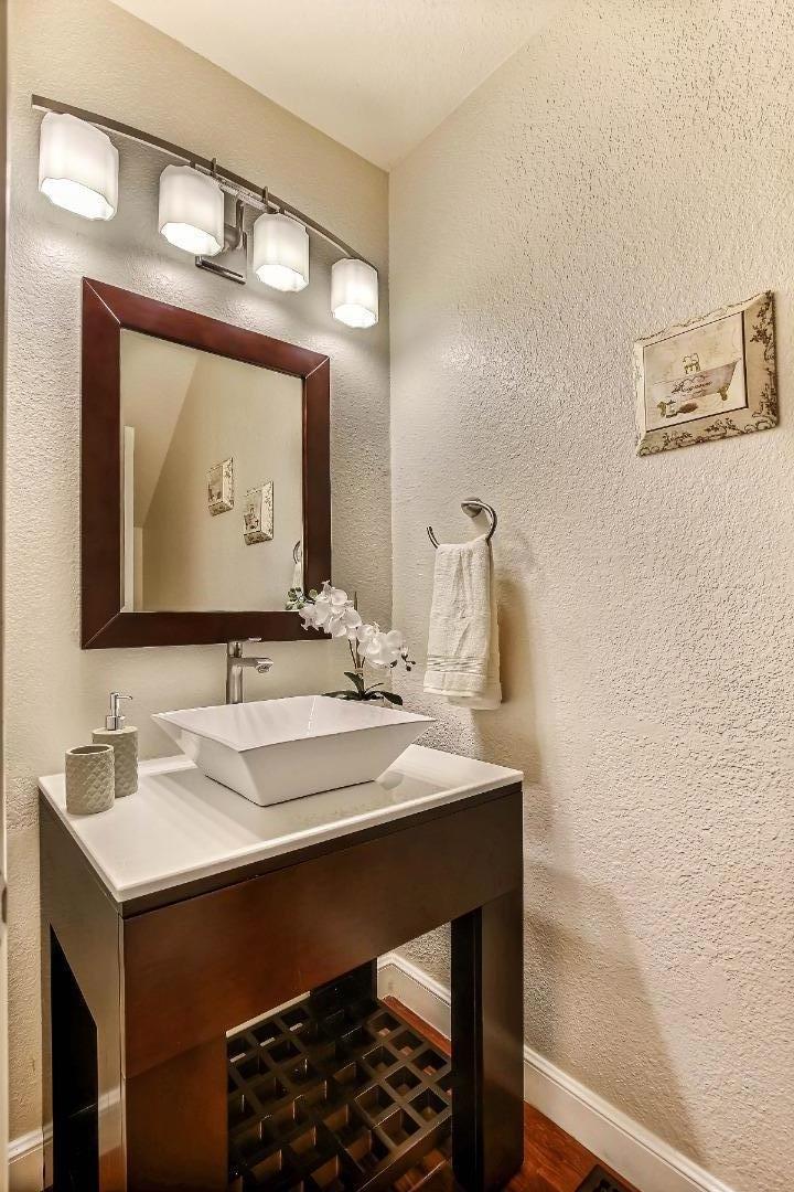 104 Redding Road Campbell, CA 95008 - Photo 19 of 23 a bathroom with a sink and a mirror
