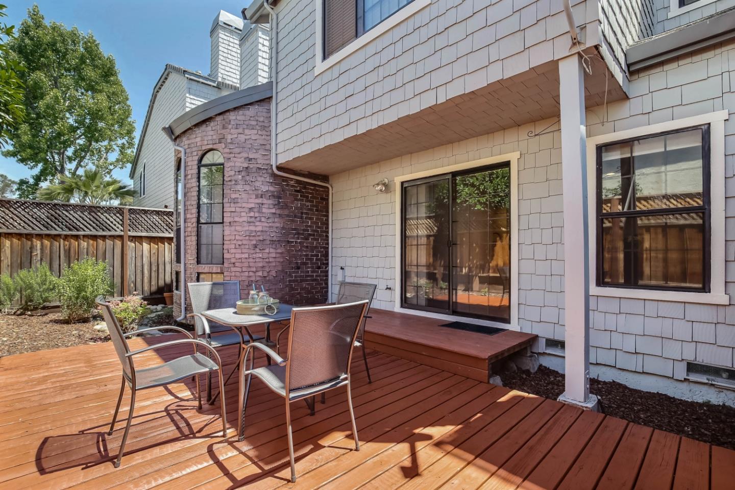 104 Redding Road Campbell, CA 95008 - Photo 20 of 23 a view of a patio with table and chairs and wooden floor