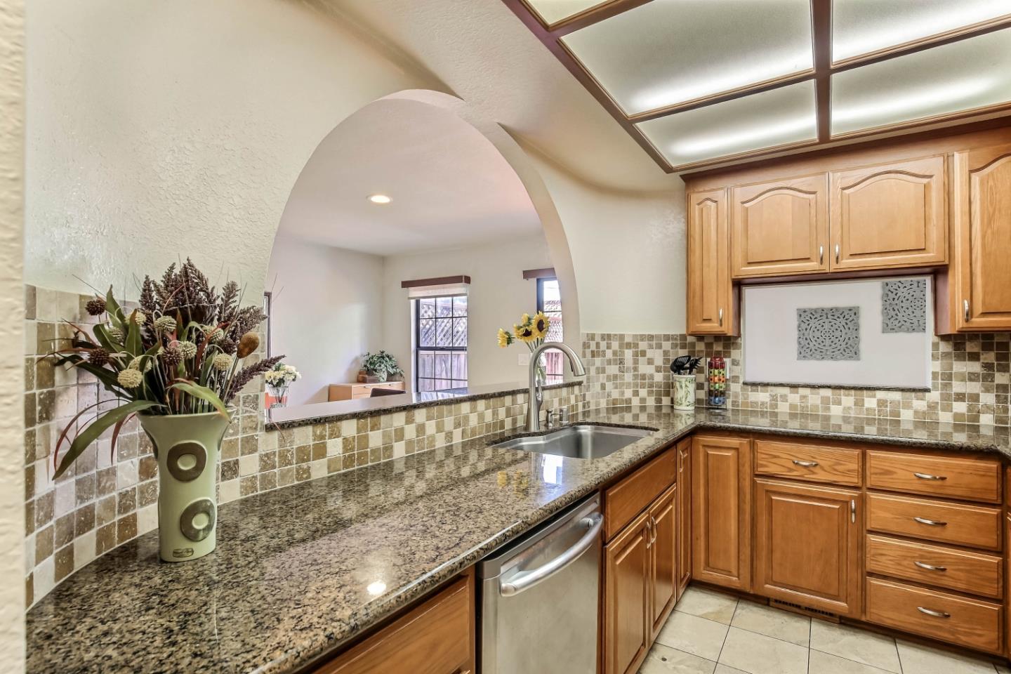 104 Redding Road Campbell, CA 95008 - Photo 6 of 23 a kitchen with stainless steel appliances granite countertop a sink a stove and cabinets