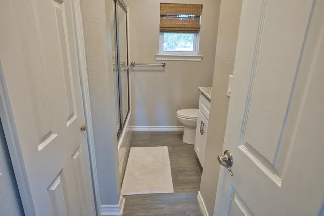 a bedroom with a bed and a chair