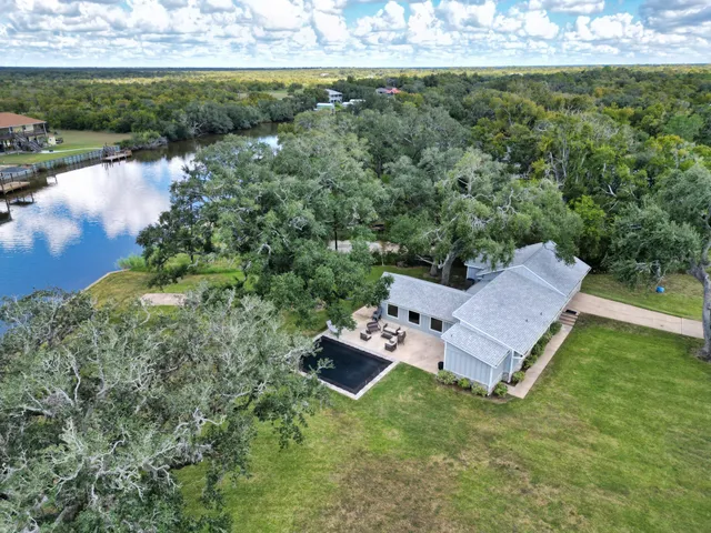 a view of a big yard with a large trees