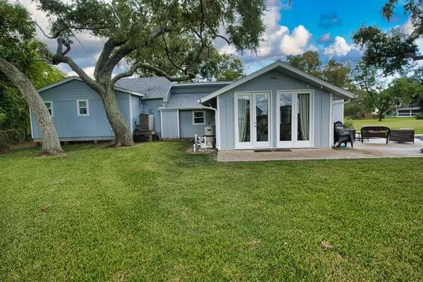 a front view of house with a garden and porch