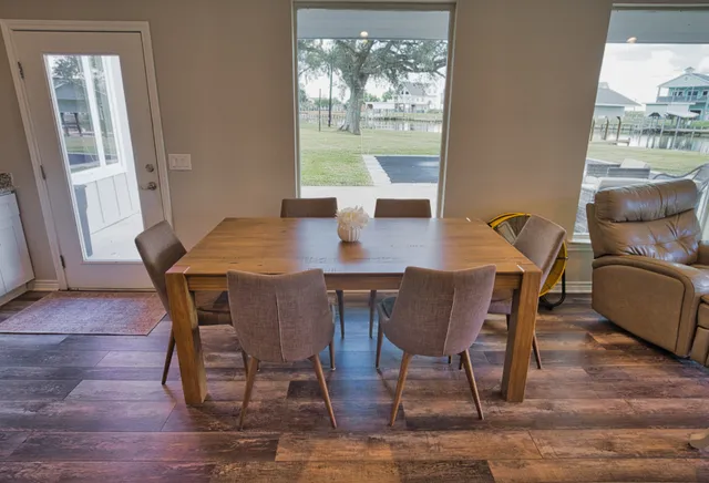 a dining room with furniture and window
