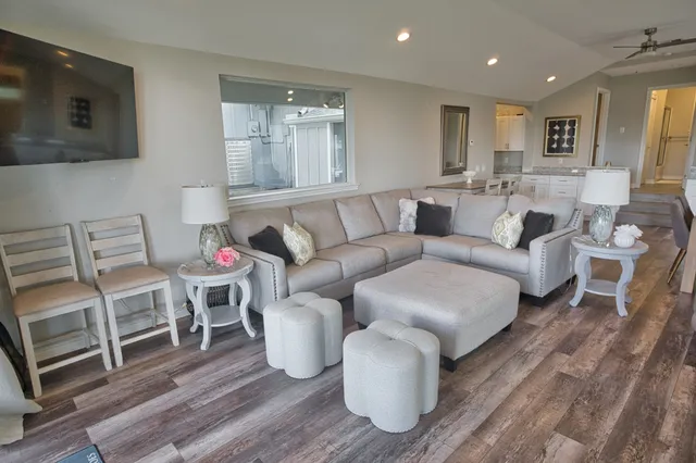 a spacious bathroom with a granite countertop sink and a mirror