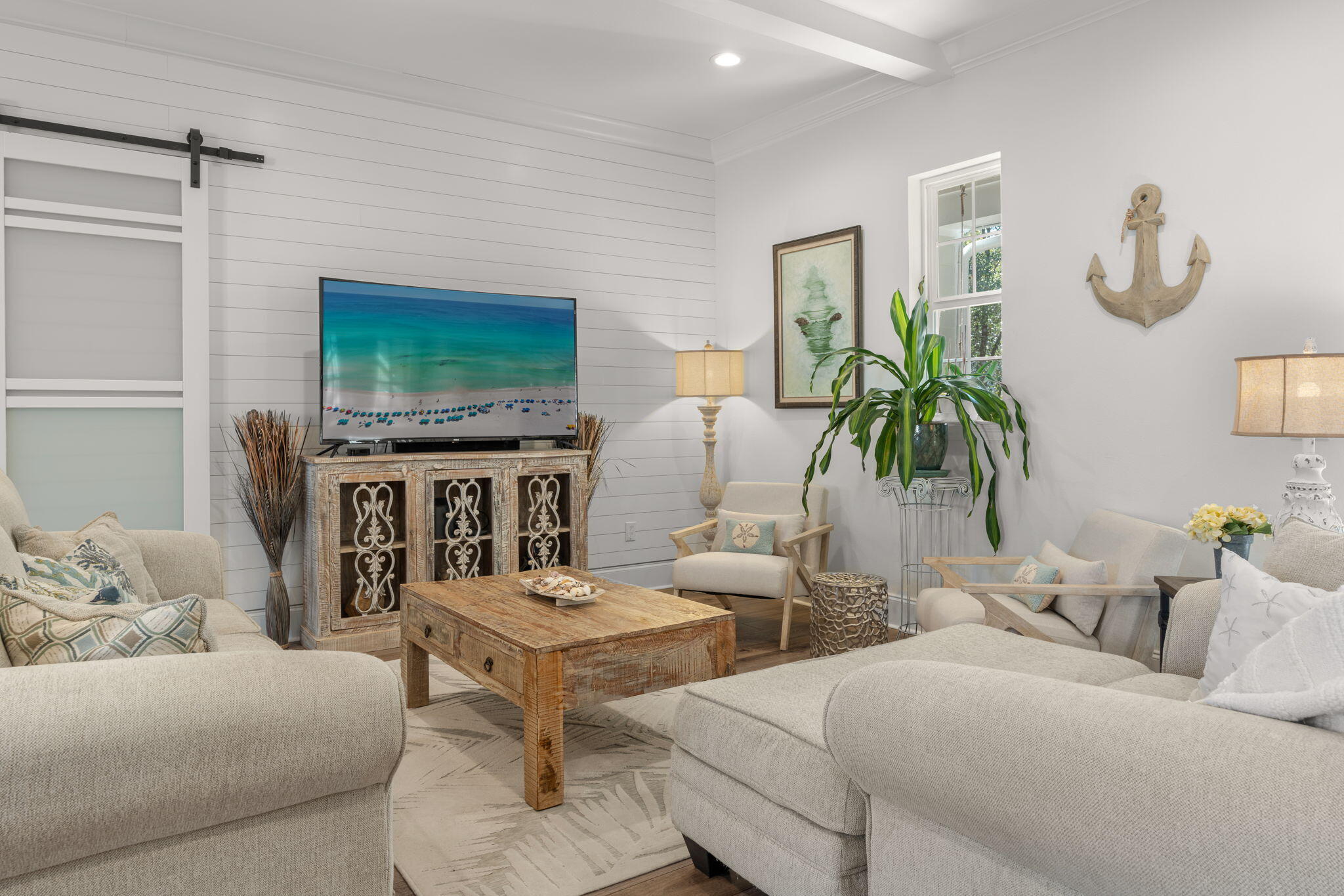 78 Grizzly Street Freeport, FL 32439 - Photo 11 of 65 a living room with fireplace furniture and a flat screen tv