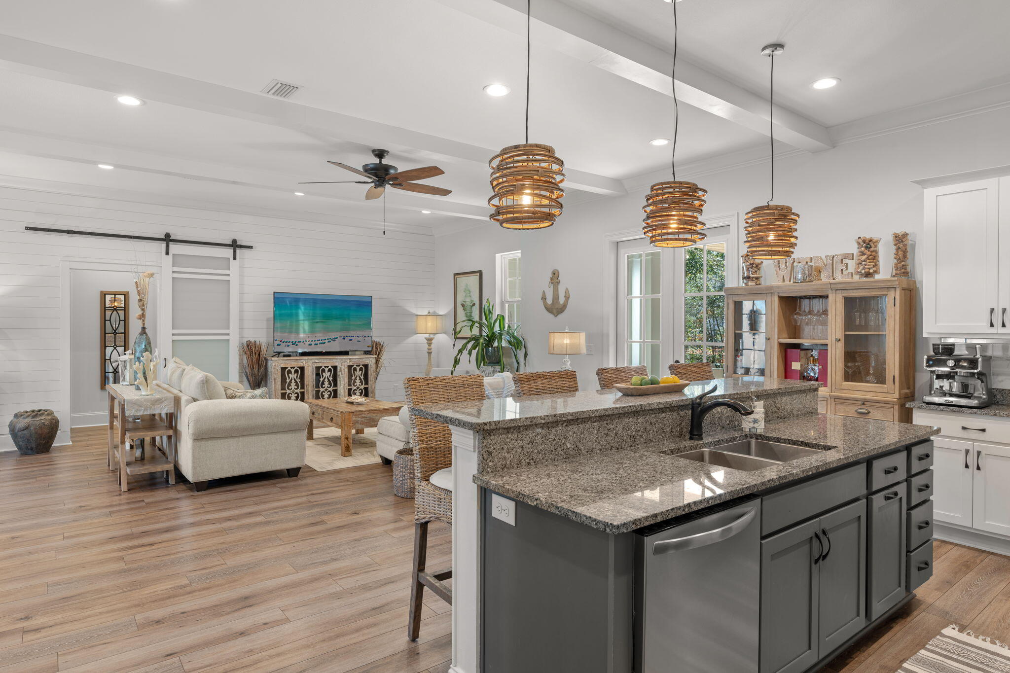 78 Grizzly Street Freeport, FL 32439 - Photo 17 of 65 a kitchen with granite countertop living room living room couches and fireplace