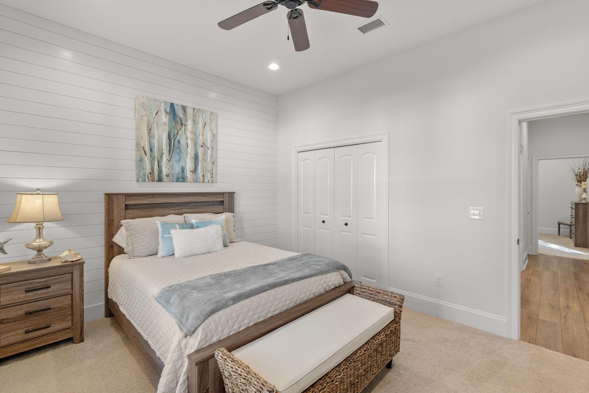 78 Grizzly Street Freeport, FL 32439 - Photo 21 of 65 a bedroom with a bed and a chandelier