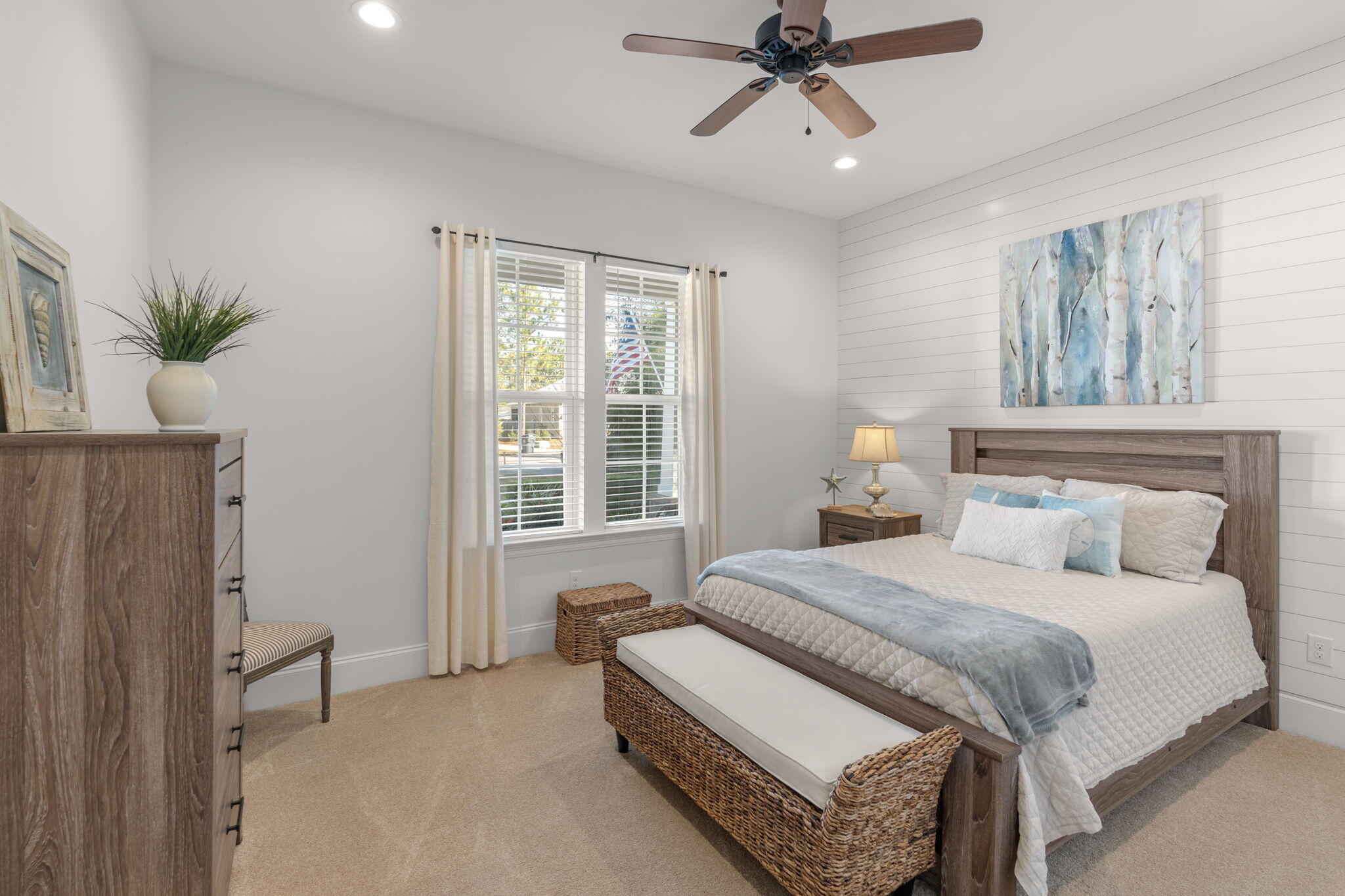 78 Grizzly Street Freeport, FL 32439 - Photo 23 of 65 a bedroom with a bed and a chandelier