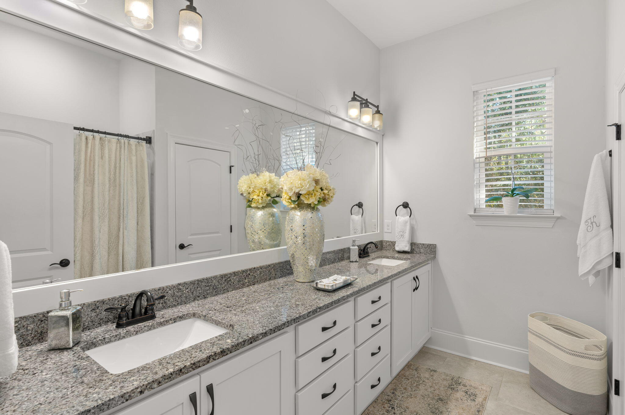 78 Grizzly Street Freeport, FL 32439 - Photo 24 of 65 a bathroom with a granite countertop double vanity sink mirror and