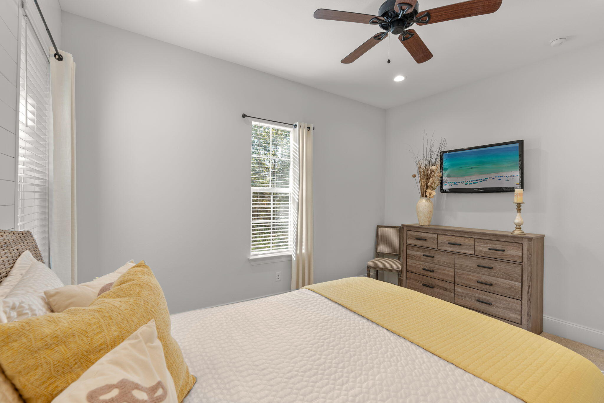 78 Grizzly Street Freeport, FL 32439 - Photo 27 of 65 a bedroom with a bed and a flat screen tv