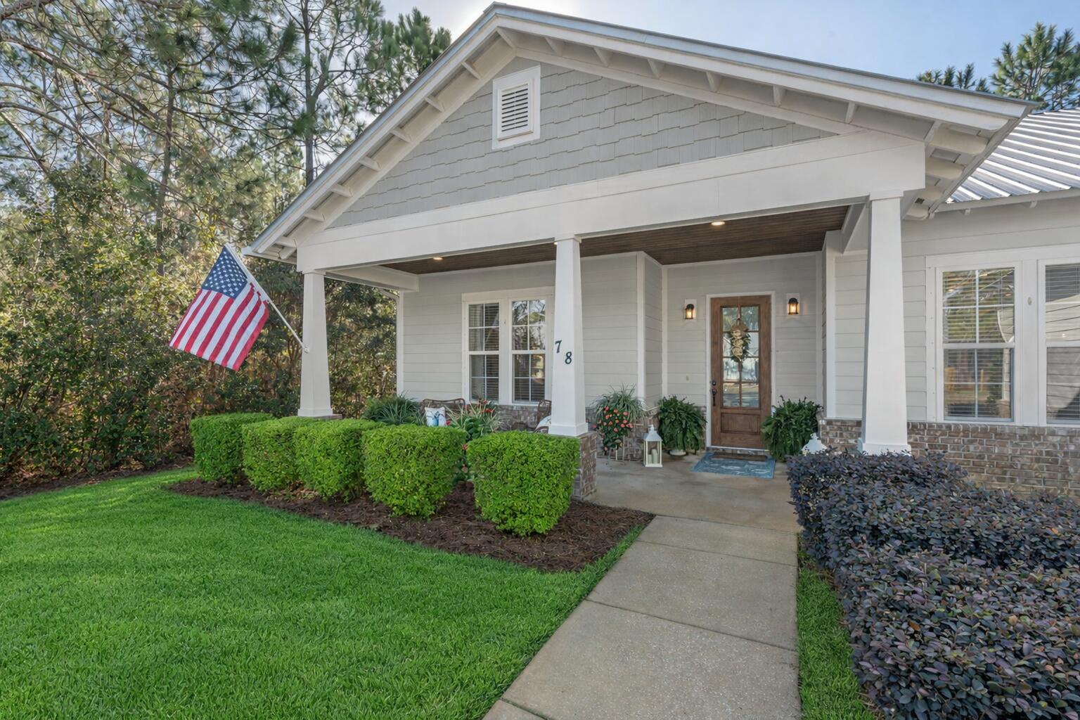 78 Grizzly Street Freeport, FL 32439 - Photo 4 of 65 a front view of a house with garden