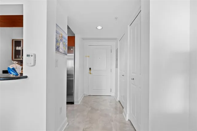a view of a hallway with paintings on the wall