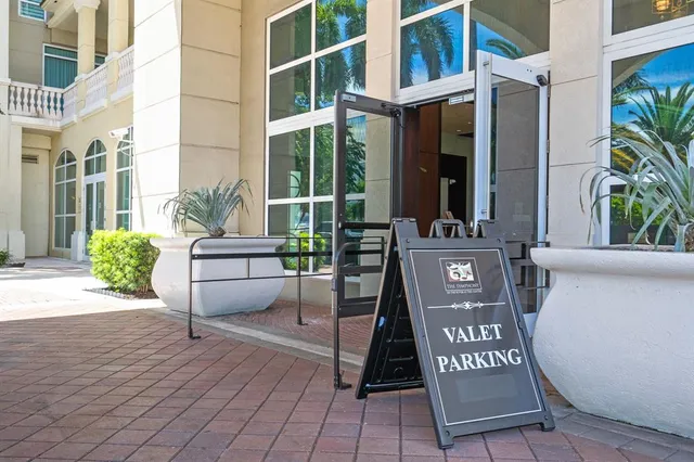 a view of living room with furniture and a chandelier