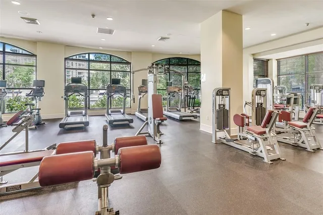 a media room with lots of chairs and mirrors
