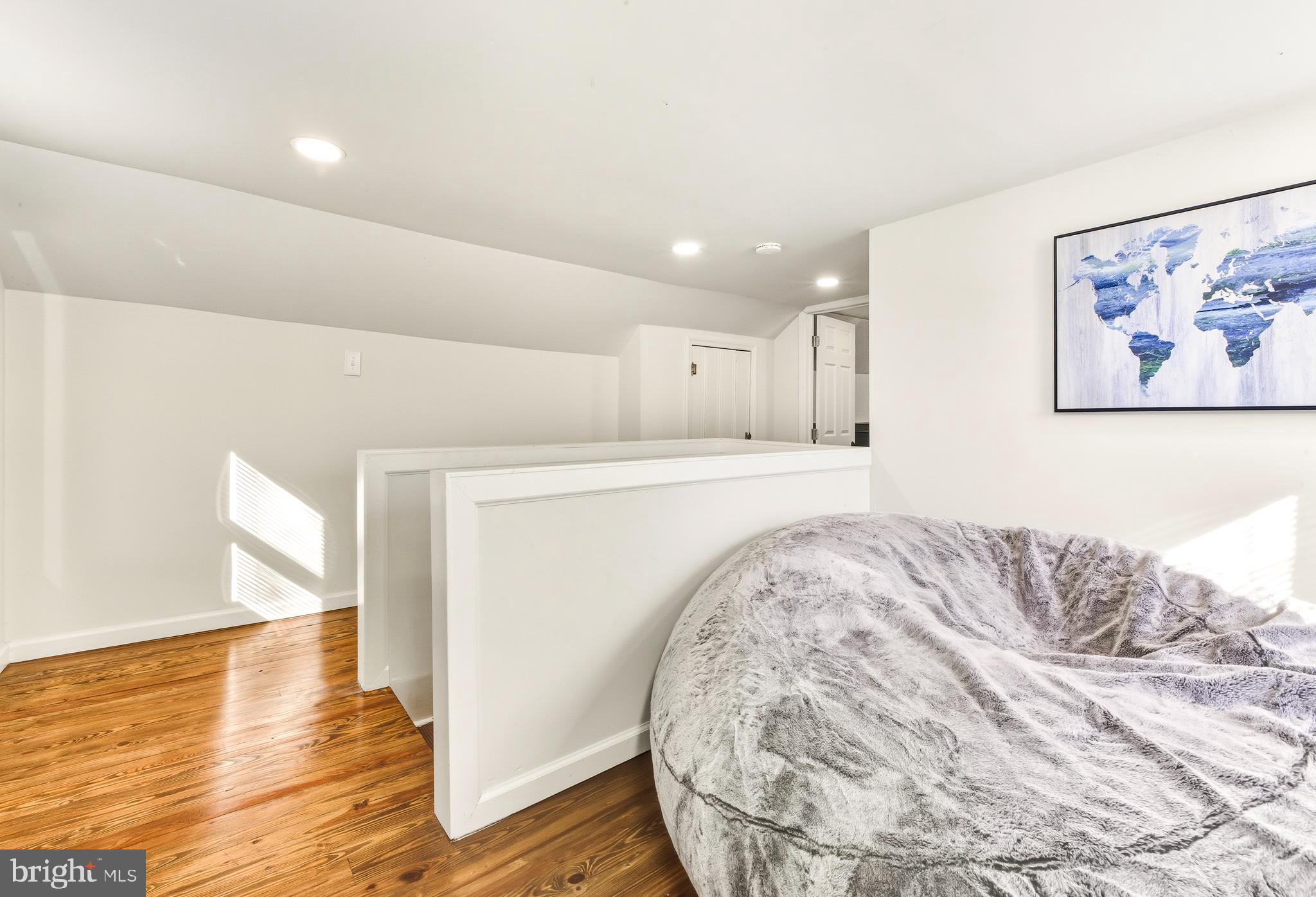 1287 Clements Bridge Road Woodbury, NJ 08096 - Photo 12 of 16 a view of a bedroom with wooden floor and bedroom