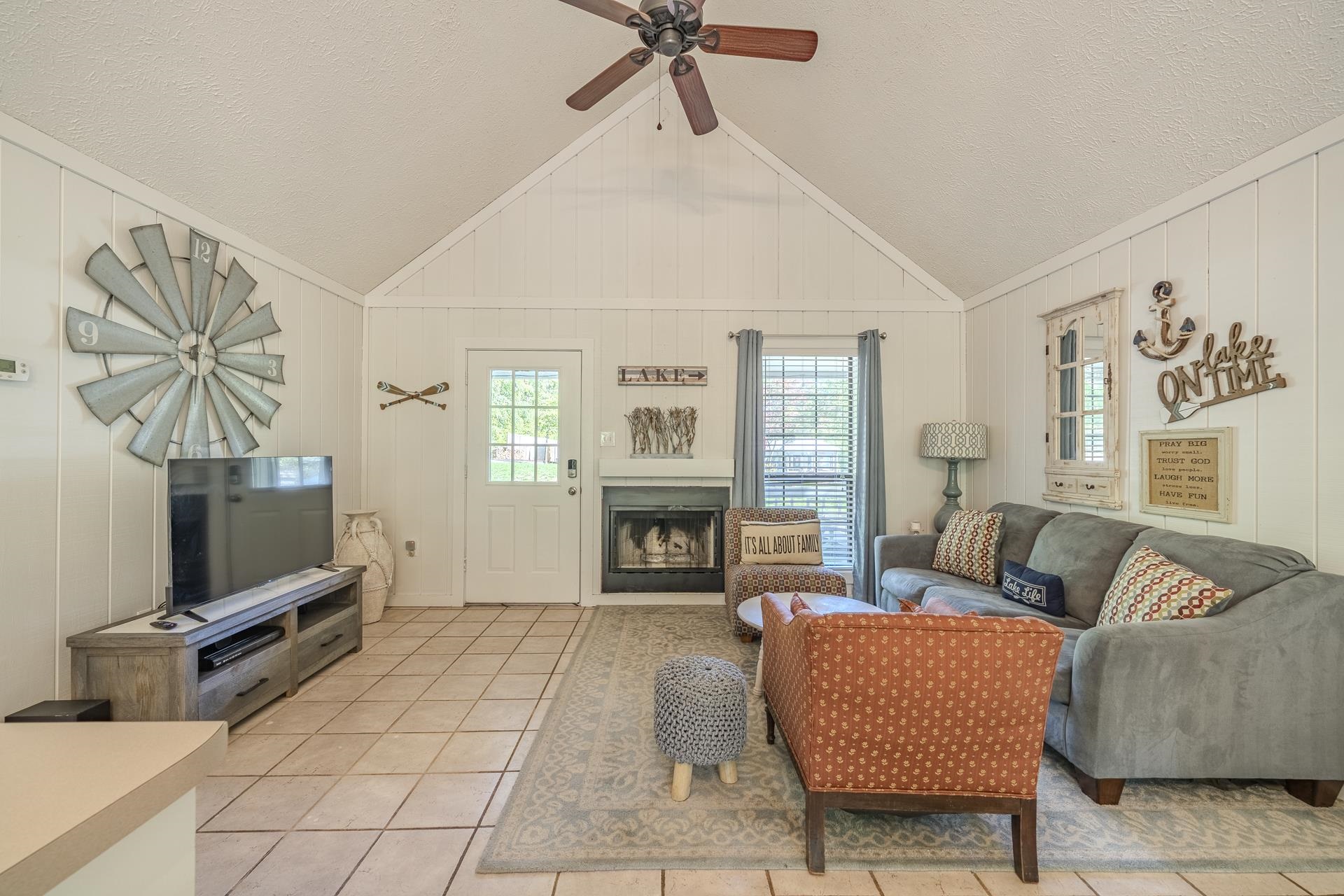 80 Contreau Road Counce, TN 38326 - Photo 5 of 28 a living room with furniture a fireplace and a flat screen tv