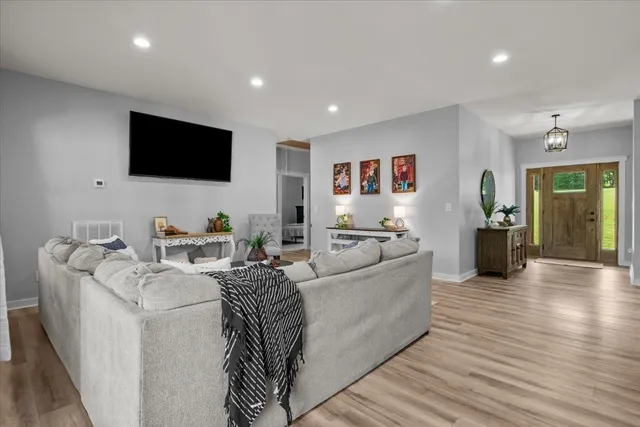 a living room with furniture and a flat screen tv
