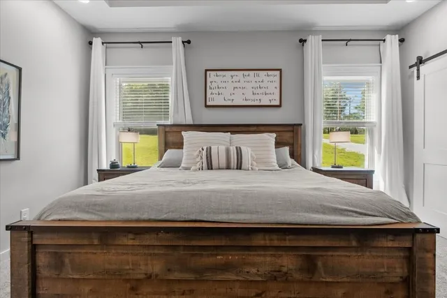 a bedroom with a bed and window