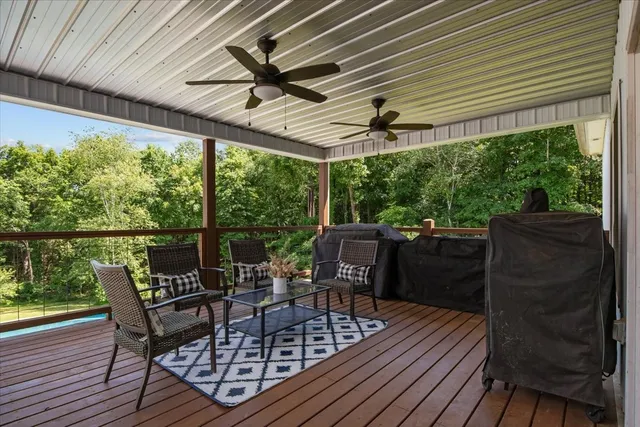 a view of a chairs and table in the balcony
