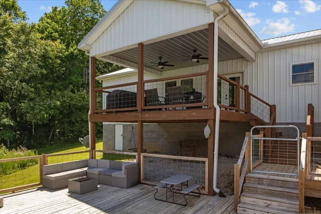 a view of balcony with chairs and wooden floor