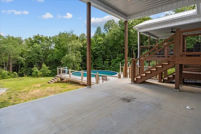 a view of a hall with a floor to ceiling window and a yard
