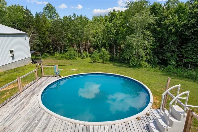 a view of a swimming pool with a patio