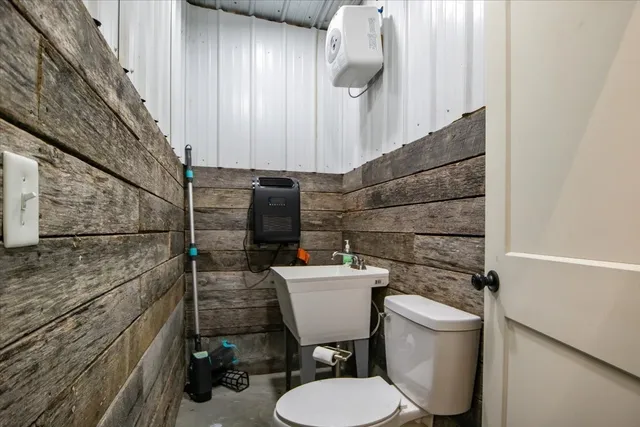 a bathroom with a toilet and a sink