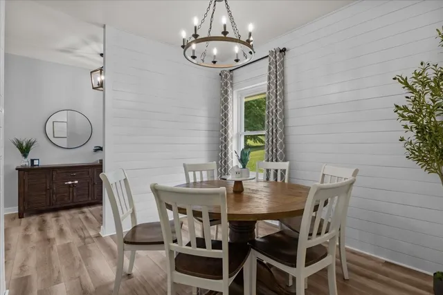 a view of a dining room with furniture and window