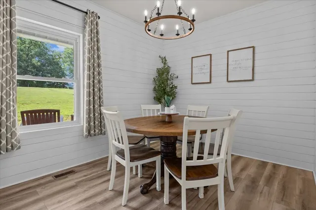 a view of a dining room with furniture window and outside view