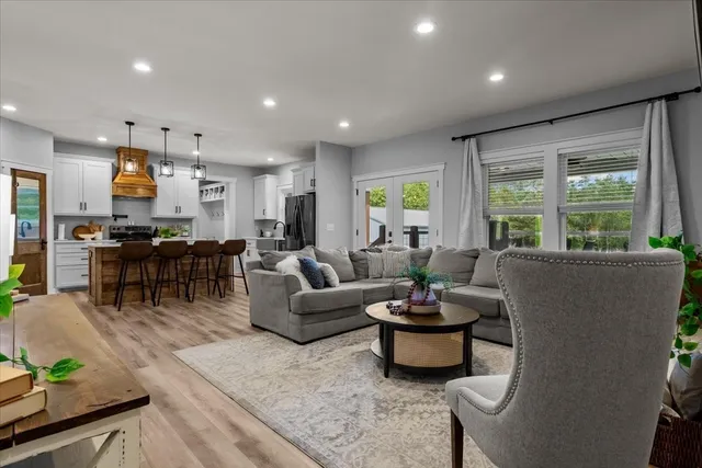 a living room with furniture and a large window