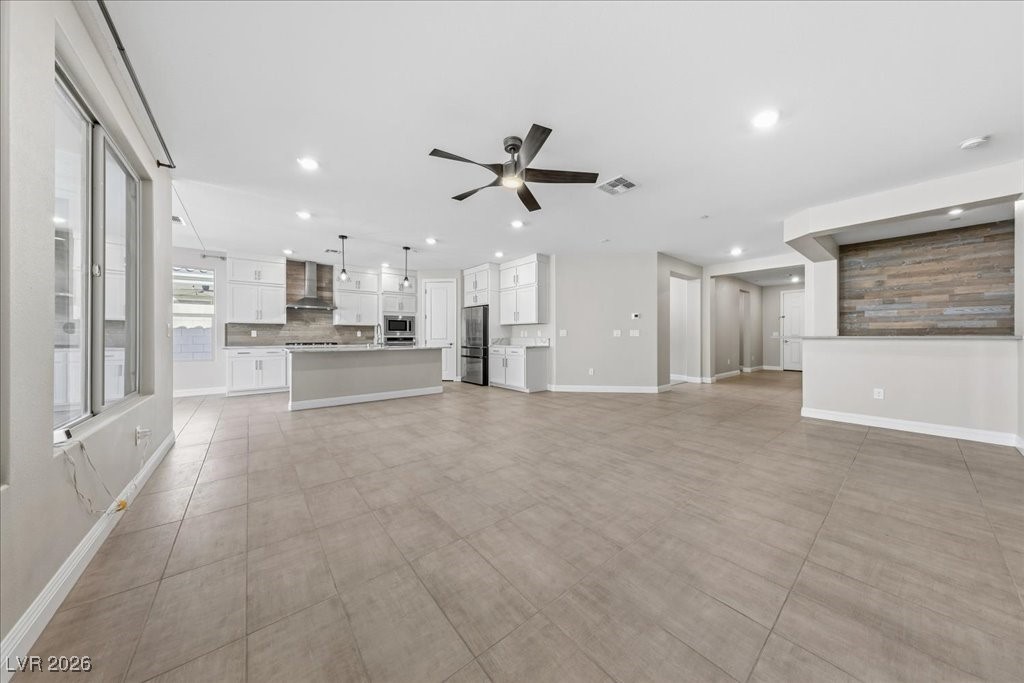 6479 Corsari Ridge Street Las Vegas, NV 89166 - Photo 11 of 38 Great room looking toward wet bar and kitchen