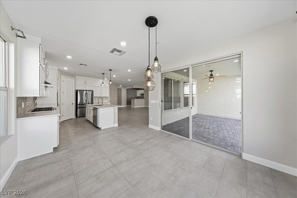 6479 Corsari Ridge Street Las Vegas, NV 89166 - Photo 6 of 38 Dining space looking to kitchen