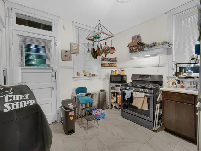 a kitchen with a stove and cabinets
