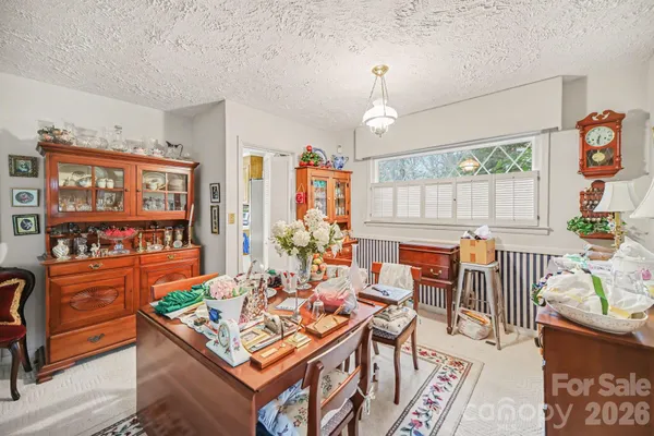 a living room with furniture a rug and a window