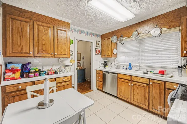 a kitchen with stainless steel appliances a sink and cabinets