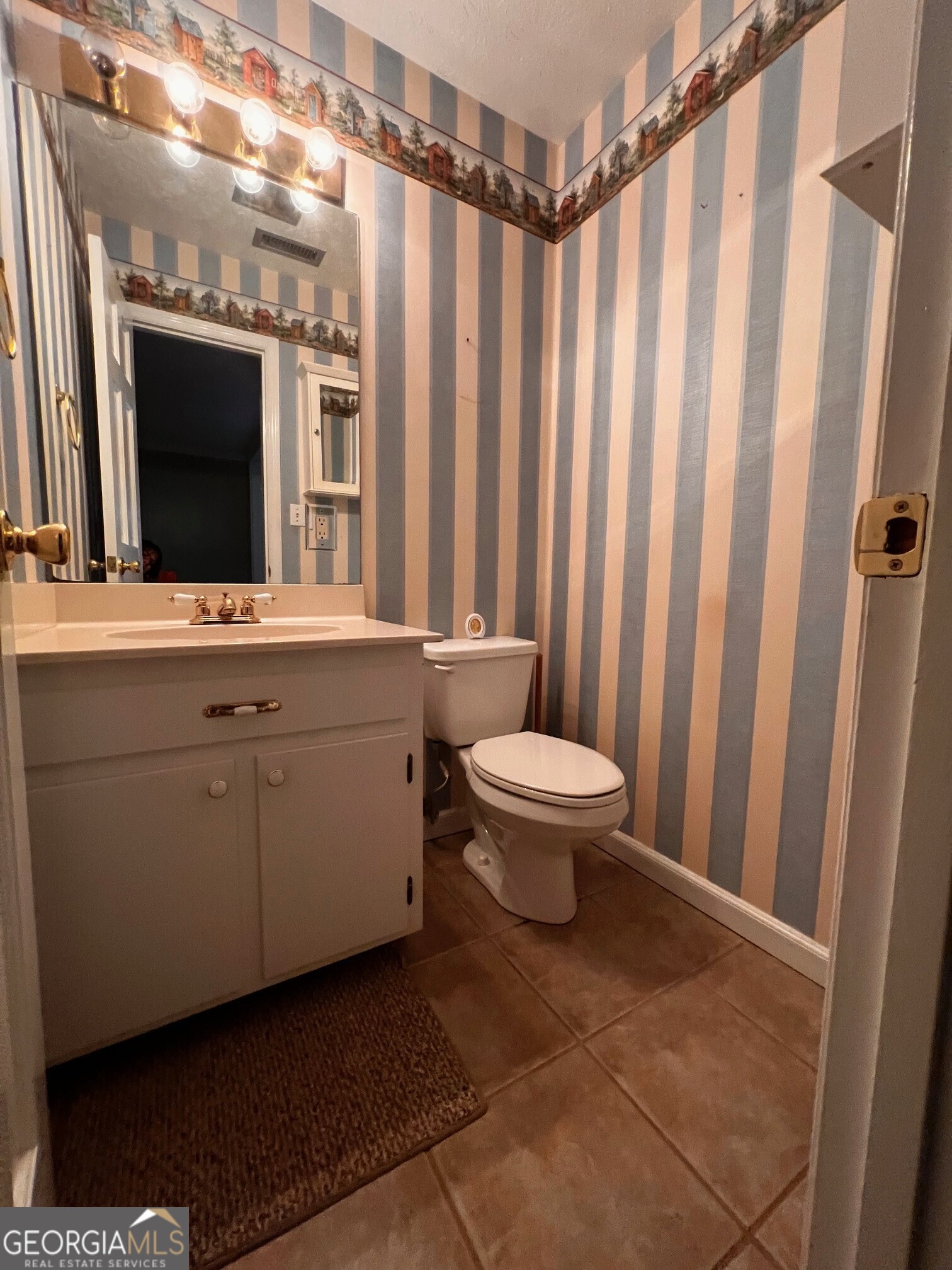24 North Brooks Road LaGrange, GA 30240 - Photo 38 of 44 a bathroom with a toilet a sink and a mirror