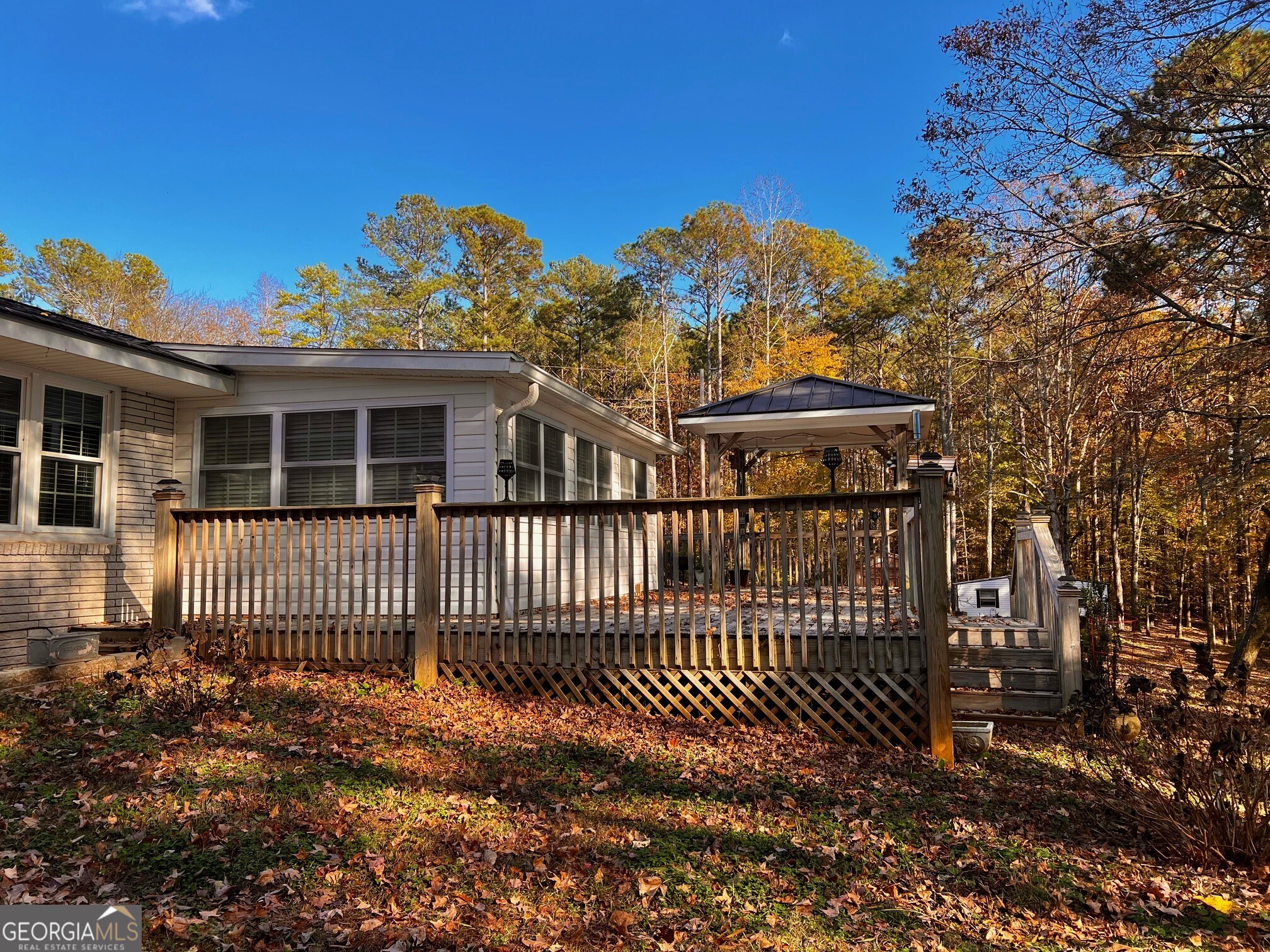 24 North Brooks Road LaGrange, GA 30240 - Photo 9 of 44 a view of a house with a small yard and wooden fence