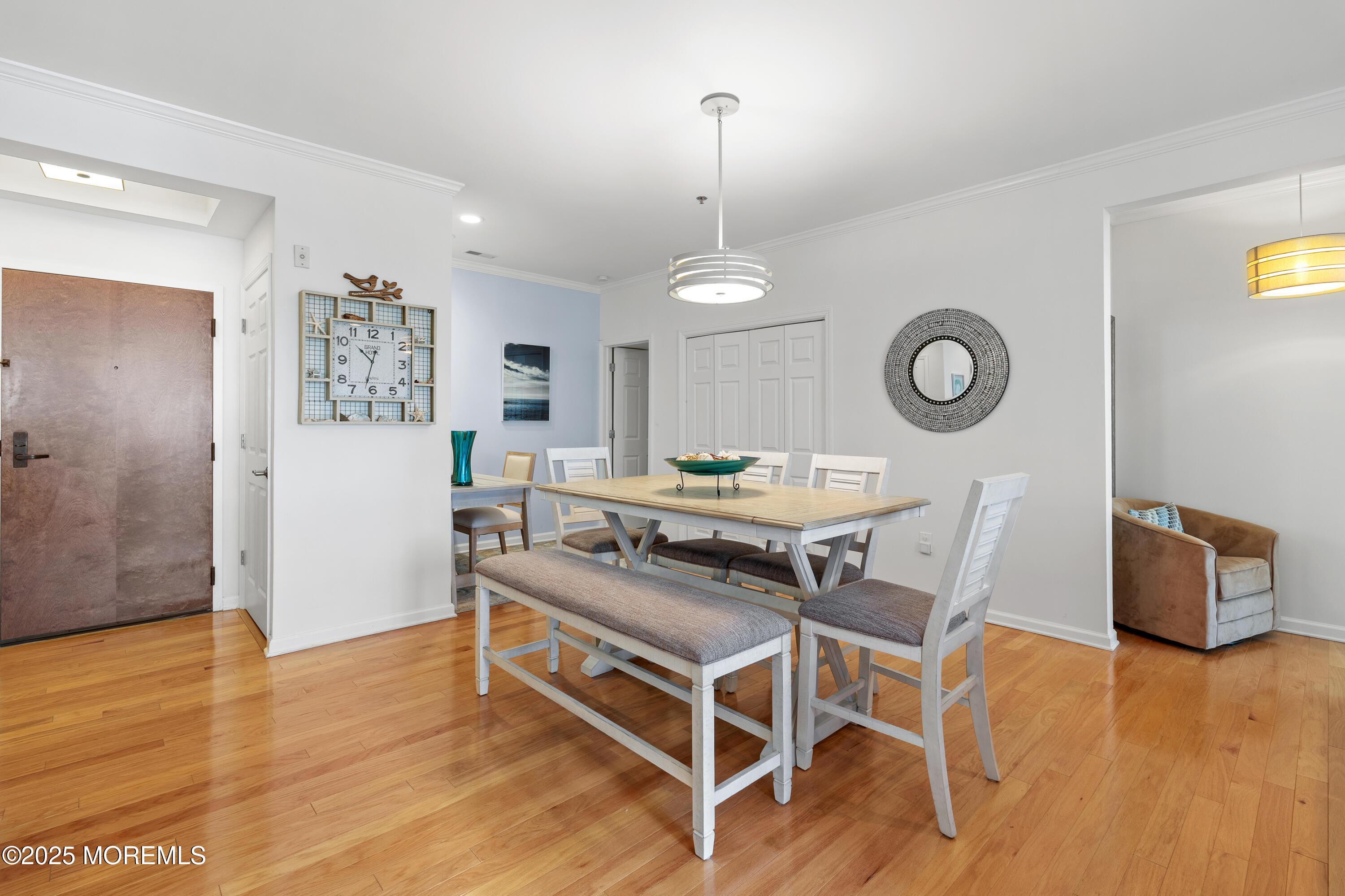 33 Cooper Avenue, Unit 208 Long Branch, NJ 07740 - Photo 43 of 43 a living room with a table and a clock