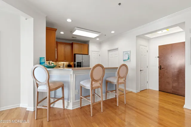 a living room with a table and a clock