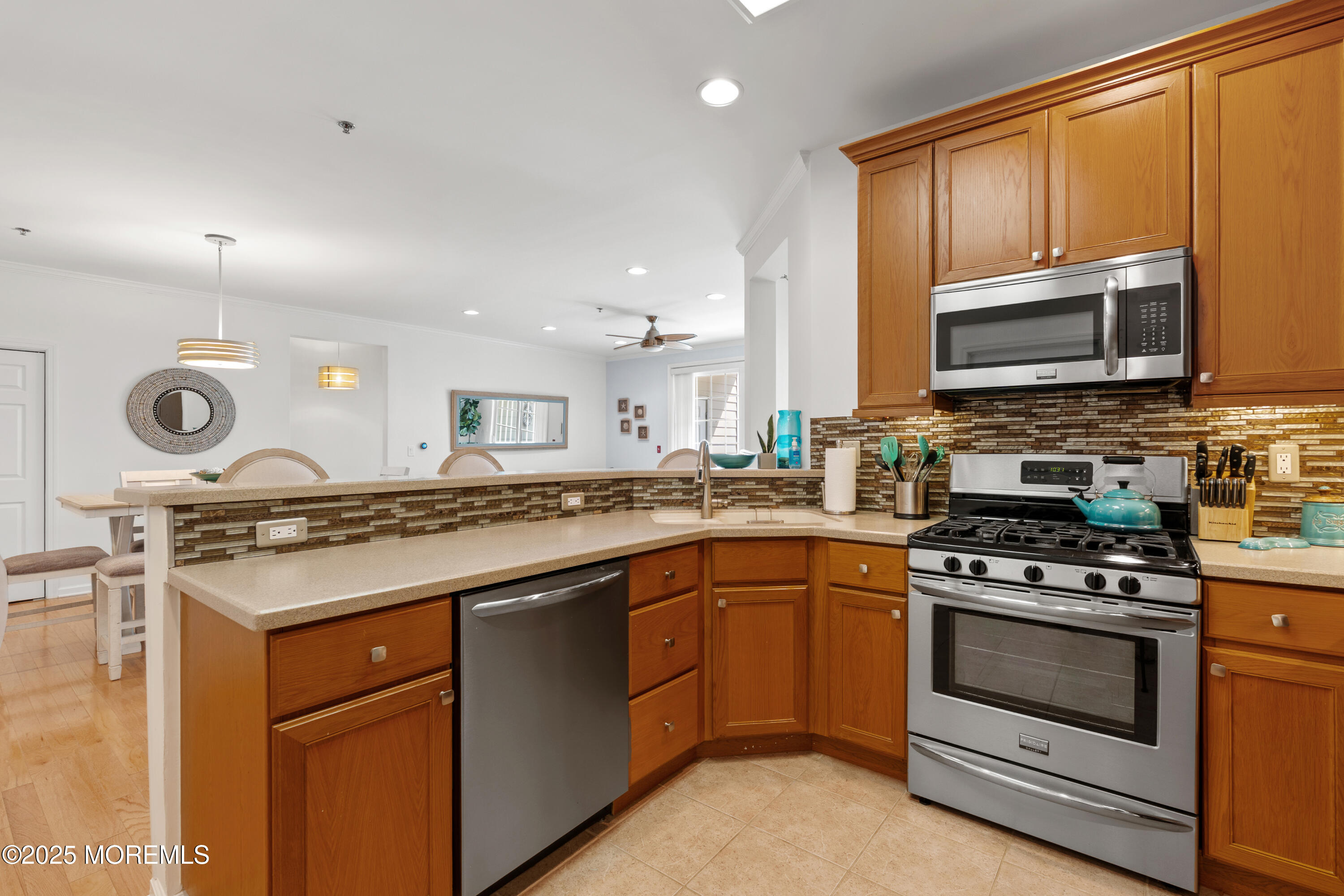 33 Cooper Avenue, Unit 208 Long Branch, NJ 07740 - Photo 11 of 43 a kitchen with a sink stove and microwave