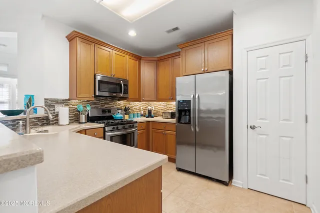 a kitchen with a sink stove and microwave