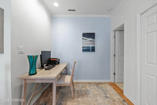 a kitchen with granite countertop a refrigerator a sink a stove a oven a dining table and chairs