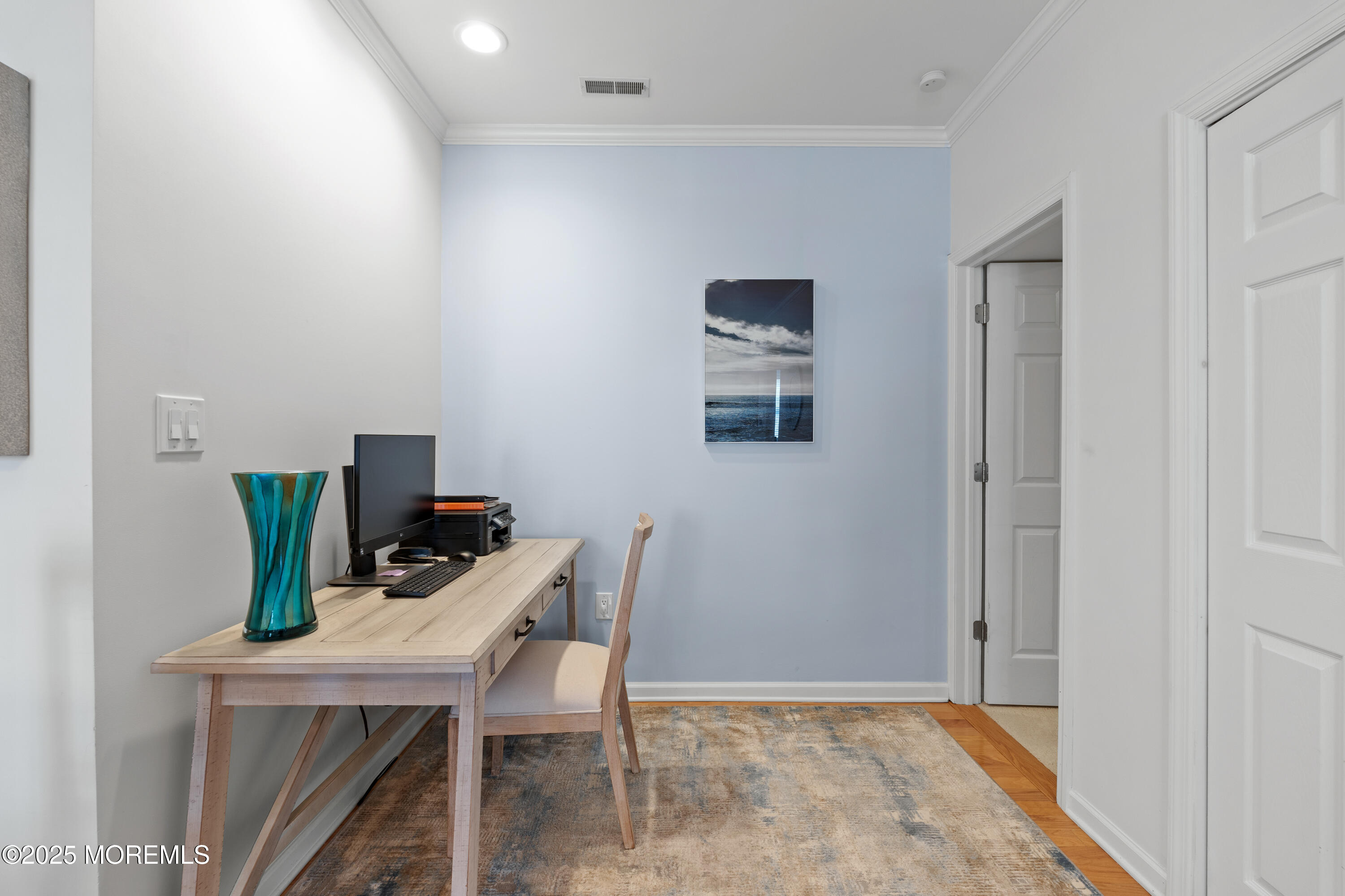 33 Cooper Avenue, Unit 208 Long Branch, NJ 07740 - Photo 13 of 43 a workspace with furniture and wooden floor