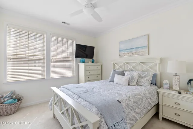 a bathroom with a bathtub a mirror and a shower