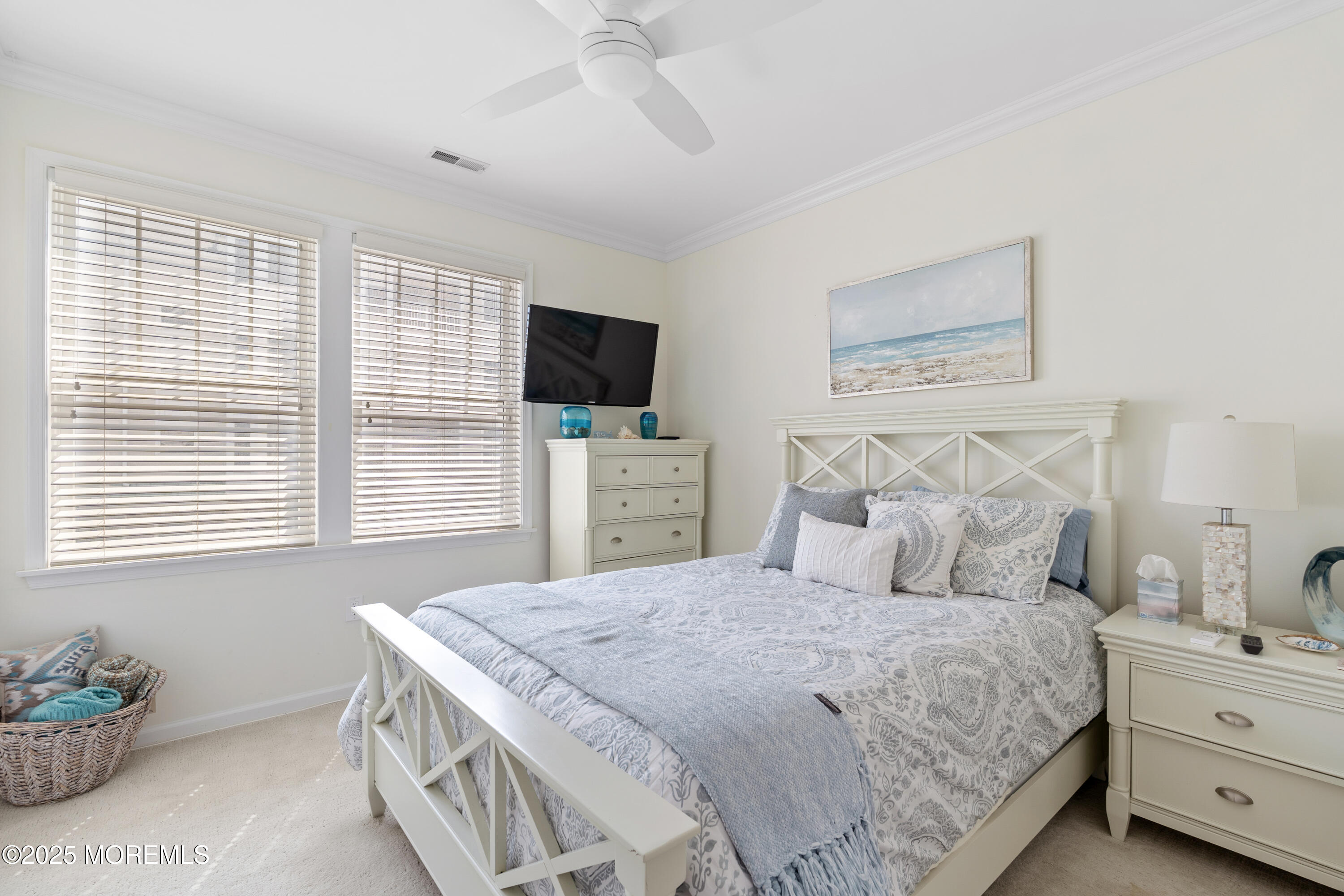 33 Cooper Avenue, Unit 208 Long Branch, NJ 07740 - Photo 18 of 43 a bedroom with a bed and a flat screen tv