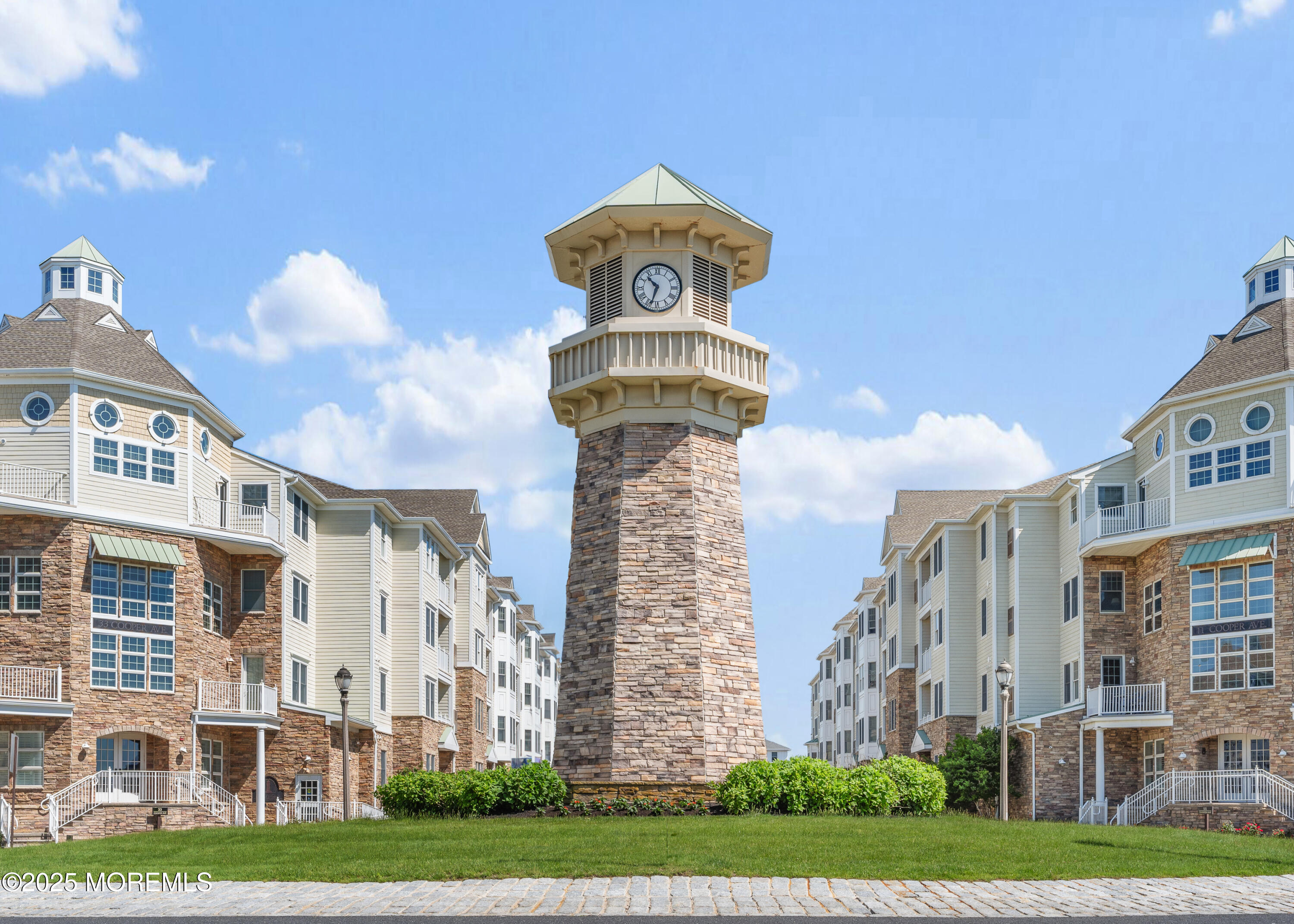 33 Cooper Avenue, Unit 208 Long Branch, NJ 07740 - Photo 2 of 43 a front view of a building with a garden and plants