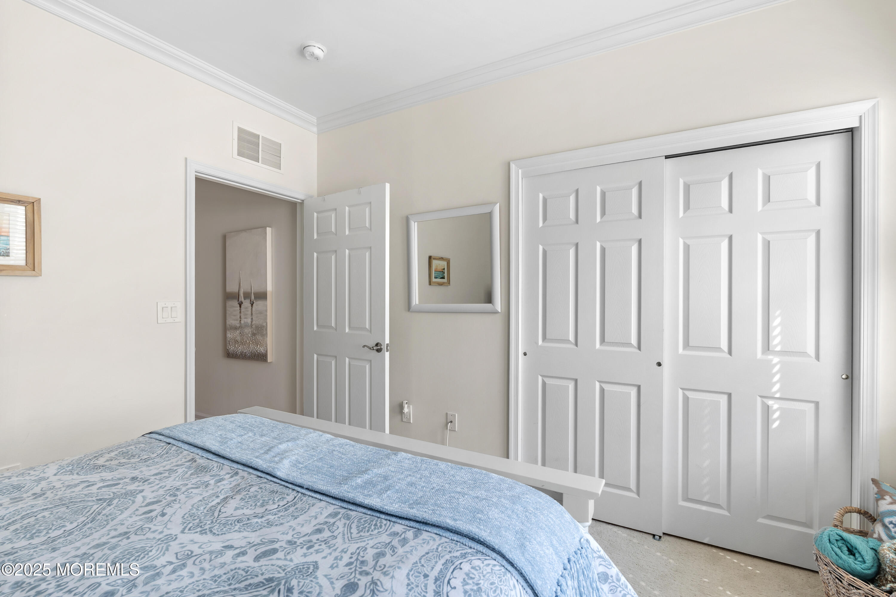 33 Cooper Avenue, Unit 208 Long Branch, NJ 07740 - Photo 19 of 43 a bedroom with a bed and hallway