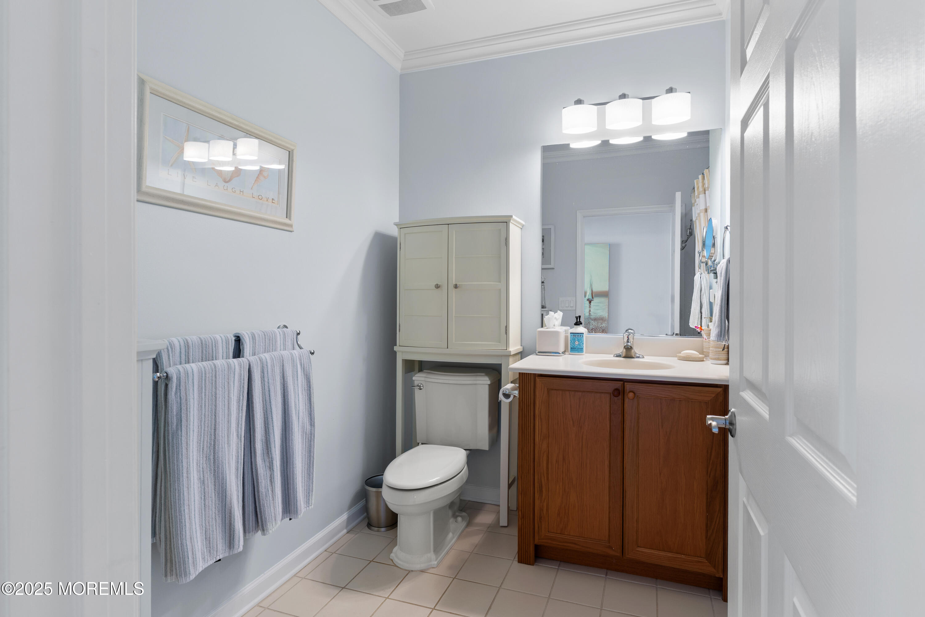33 Cooper Avenue, Unit 208 Long Branch, NJ 07740 - Photo 20 of 43 a spacious bathroom with a toilet sink and mirror